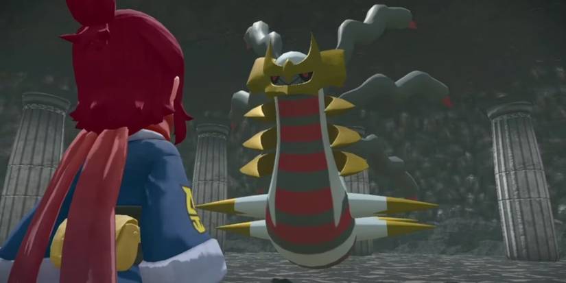 Giratina inside Turnback Cave in Pokemon Legends: Arceus, standing in front of the player.