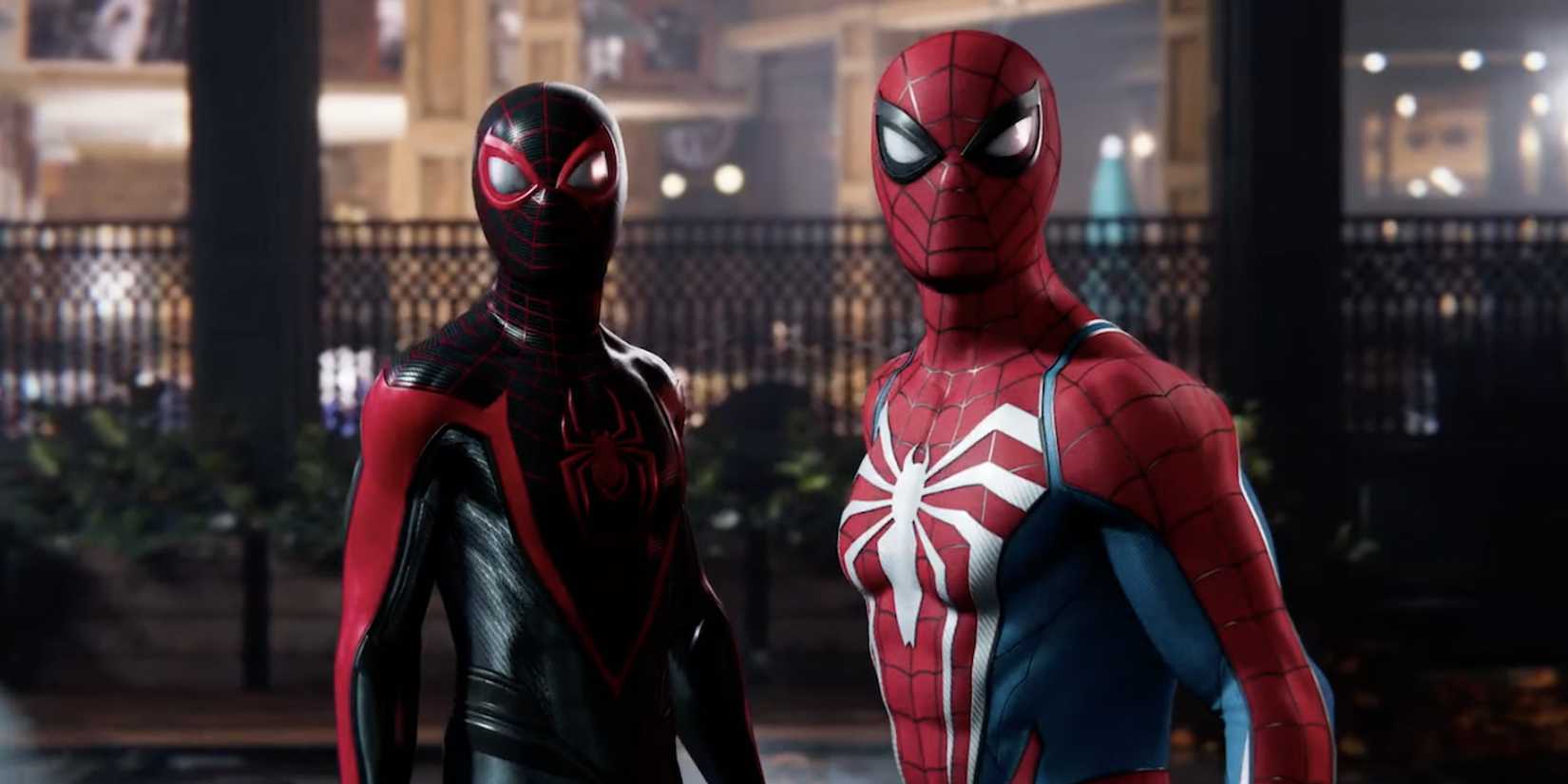 Dos hombres de araña, Miles Morales y Peter Parker, uno al lado del otro en una pelea.