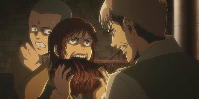 Sasha Braus mange un morceau de viande