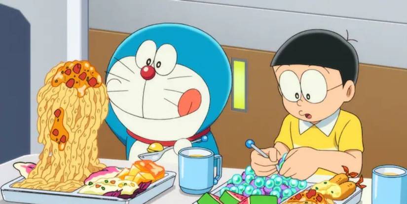 Doraemon est assis à côté d'un garçon sur le point de manger une grande portion de nourriture, sa langue se léchant les lèvres.