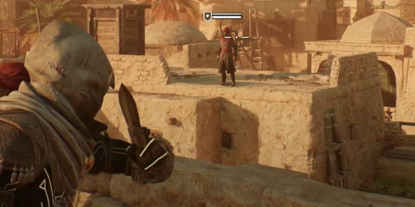The Assassin's Creed Mirage character is looking at an enemy will holding up their dagger.