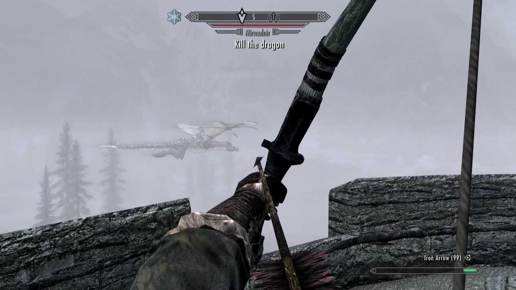 Mirmulnir flies around a tower in the mist in Skyrim.