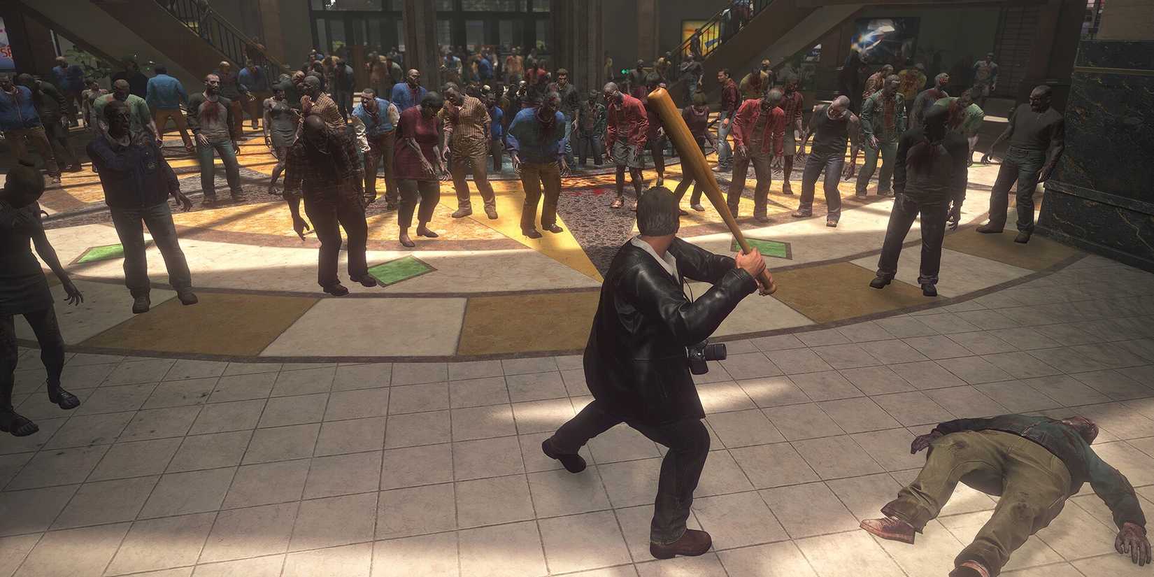 Frank with a baseball bat in front of zombies in Dead Rising Deluxe Remaster