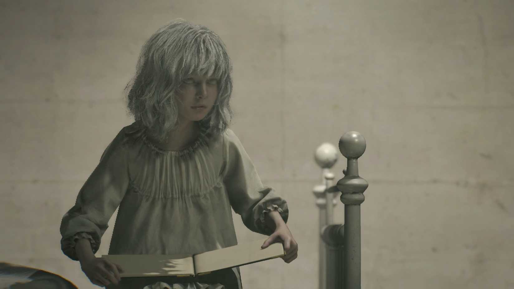 Emily holding a book in her cell.