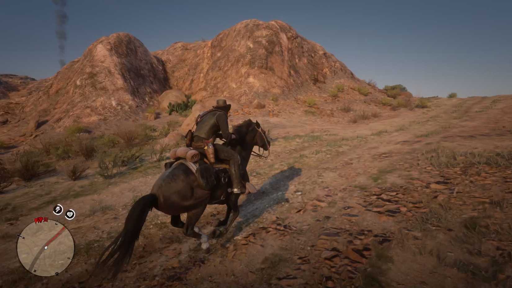 John Marston Riding His Horse in a Desert in Red Dead Redemption 2